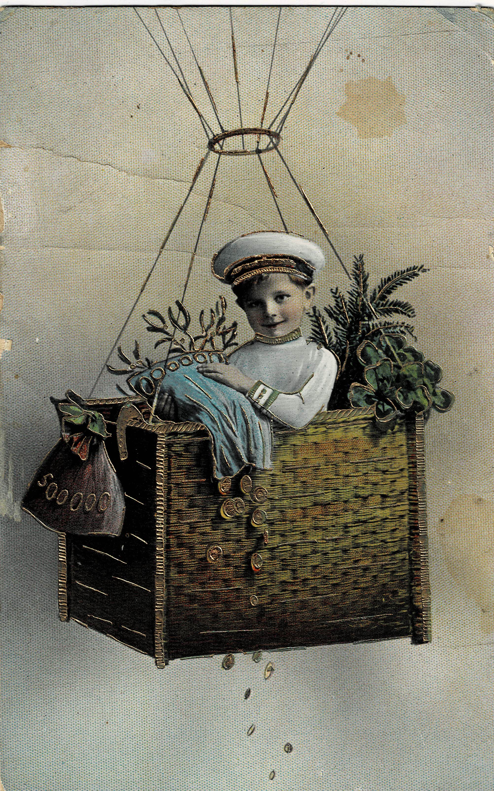 POSTAL NIÑO DENTRO DE UNA CESTA CON RELIEVES.