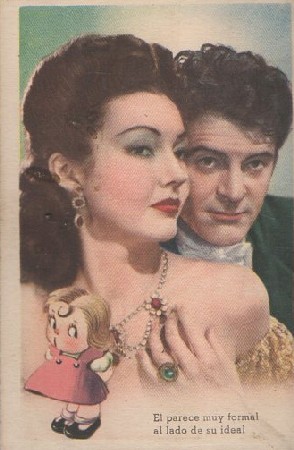 POSTAL ROMANTICA. EL PARECE MUY FORMAL AL LADO DE SU IDEAL